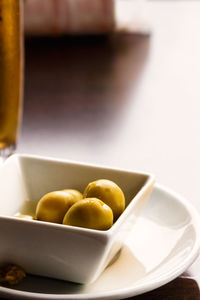 Close-up of fruits in bowl on table