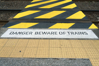 High angle view of text and road marking on tramway