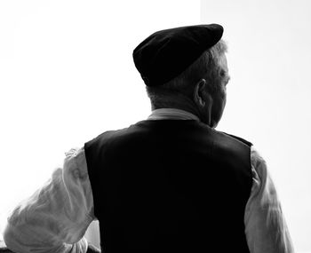 Rear view of man standing against sky