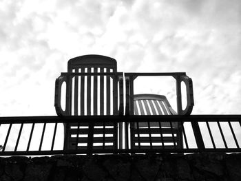 Low angle view of built structure against cloudy sky