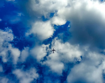 Low angle view of airplane in sky