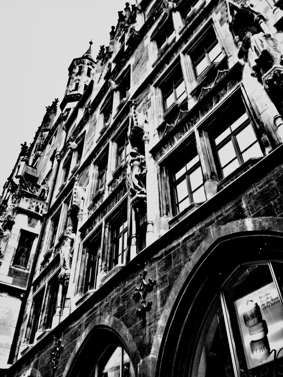 architecture, built structure, building exterior, low angle view, window, arch, building, residential building, residential structure, old, clear sky, sky, facade, day, outdoors, no people, balcony, history, house, brick wall