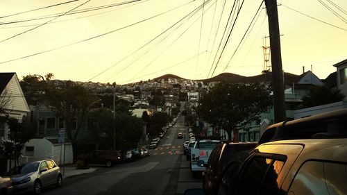 Traffic on road at sunset