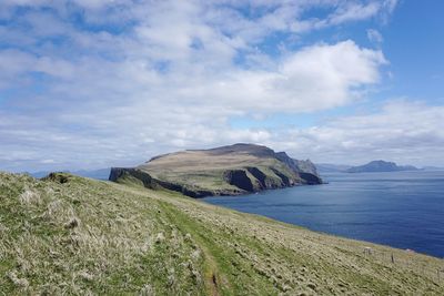 Scenic view of sea against cloudy sky