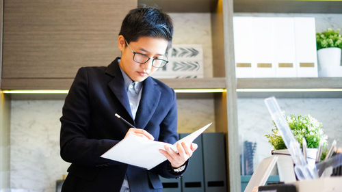 Man looking at camera on table