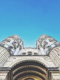 Low angle view of building against clear blue sky