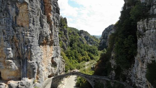 Panoramic view of bridge amidst trees against sky