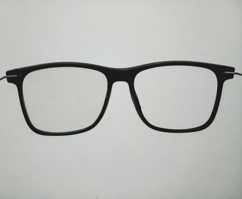 Close-up of sunglasses against white background