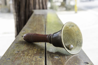 Close-up of bell on table at temple