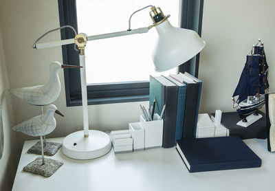 Close-up of electric lamp on table