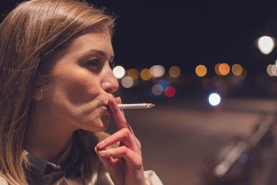 Close-up of woman smoking cigarette