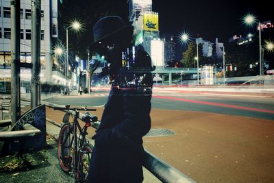 Man on city street at night