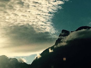 Low angle view of silhouette mountain against sky