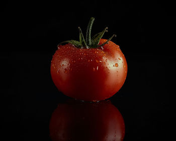 Close-up of strawberry over black background