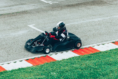 High angle view of man sitting on motorcycle