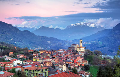 High angle view of townscape and mountains against sky
