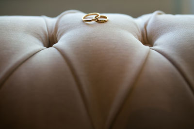 Close up of rings on sofa