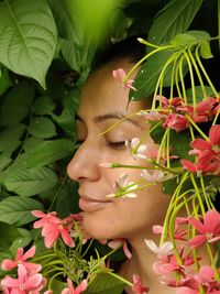 Potrait of woman with flowers. breathing nature