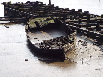 Abandoned boat in water