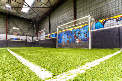 Graffiti on wall of soccer field