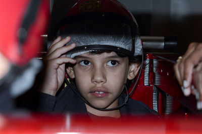 Close-up of boy wearing sports helmet