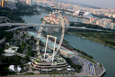 High angle view of buildings by river in city