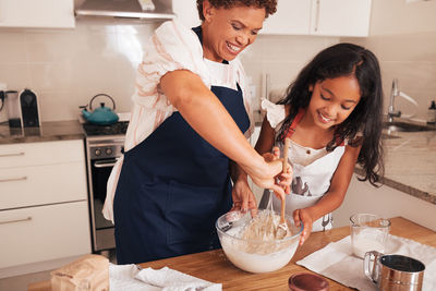 Friends preparing food at home