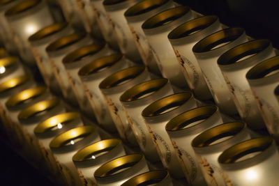 Row of lit candles in church