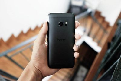 Cropped image of hand holding smart phone