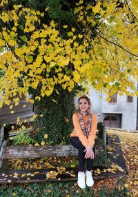 Portrait of woman against plants during autumn