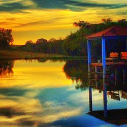 Scenic view of calm lake at sunset