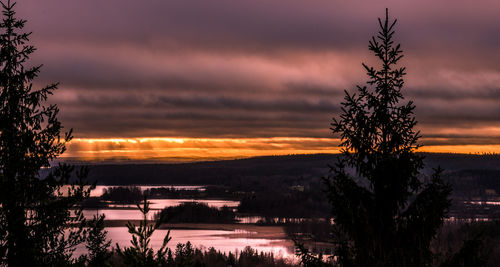 Scenic view of landscape against cloudy sky