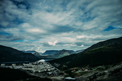 Scenic view of mountains against cloudy sky