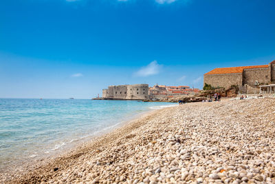 The beautiful banje beach and dubrovnik city