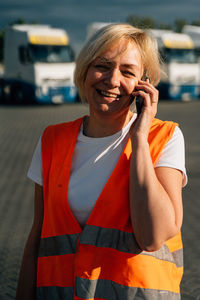 Portrait of young woman using mobile phone