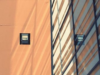 Low angle view of orange wall in building