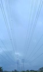 Low angle view of electricity pylon against sky