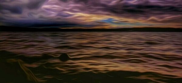 Scenic view of sea against cloudy sky