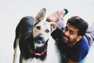 Funny young man with his dog