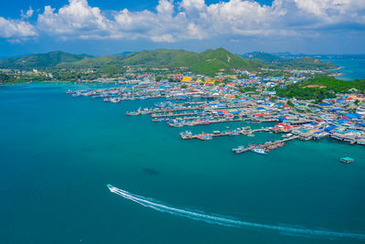 High angle view of sailboats in sea against sky