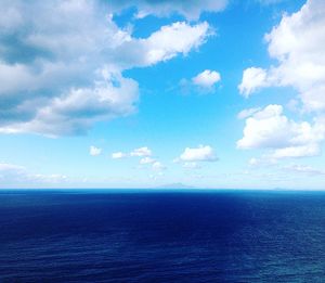 Scenic view of sea against blue sky