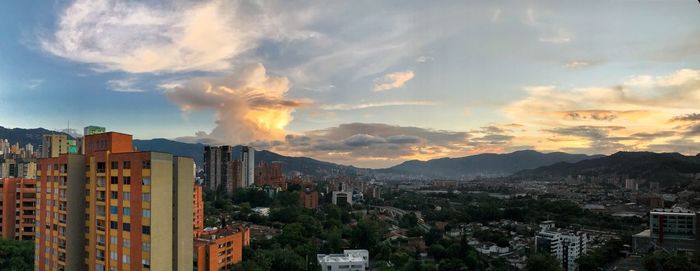 High angle view of buildings against sky during sunset