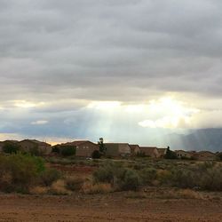 Scenic view of landscape against cloudy sky