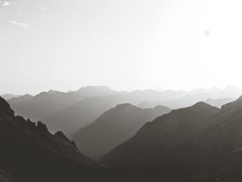 Scenic shot of silhouette mountain ranges against the sky