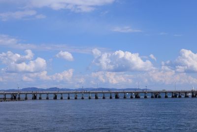 Pier over sea against sky
