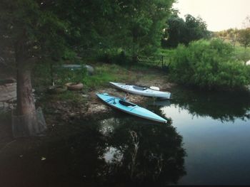 Boats moored in calm lake