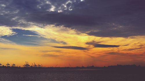 Scenic view of landscape against cloudy sky