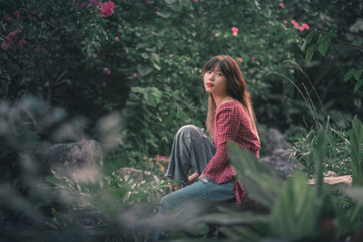 Young woman standing on field