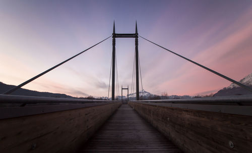 View of suspension bridge at sunset