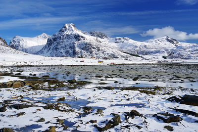 Scenic view of snowcapped mountains against sky